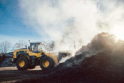 Bulldozer and compost pile
